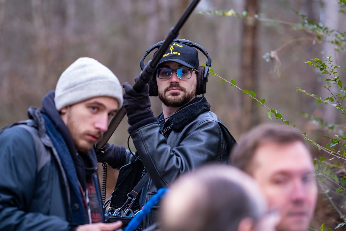 Barry Rathbun operating a boom on an outdoor location shoot